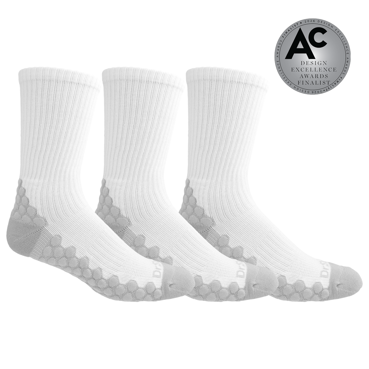 Three pairs of white crew socks with gray honeycomb patterned heels and toes, displayed on a clean white background with an 'AC Design Excellence Awards Finalist' badge in the top right corner.