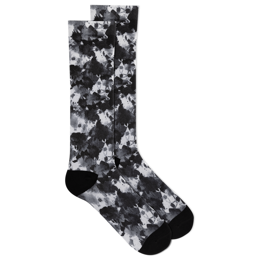 Camouflage-patterned sock on a black background