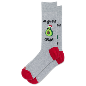 A pair of heather gray crew socks with red heels and toes, featuring a graphic of a green avocado wearing a Santa hat with the text 'Jingle Bell Guac'.