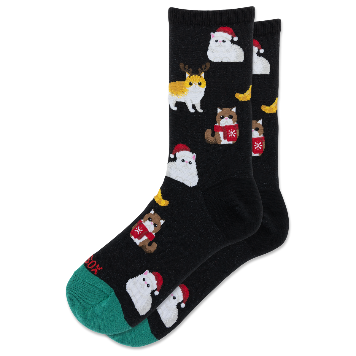 A pair of black crew socks with a repeating pattern of cute cats dressed in winter outfits, including Santa Claus and a reindeer, with a green toe cap and heel.