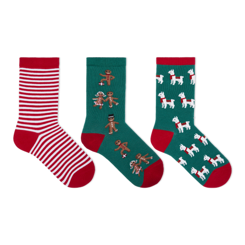Three pairs of Christmas-themed crew socks displayed side-by-side on a plain white background. The left pair features red and white horizontal stripes with a red toe and heel.