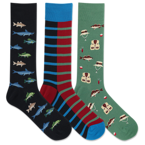 Three pairs of crew socks displayed together on a white background. The left sock is black with blue, green, and gray fish patterns; the middle sock has vertical stripes in blue, red, and black; the right sock is green with fishing vest and fish patterns.