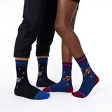 Two pairs of socks with space-themed designs on a white background thumbnail