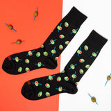 Black socks with green olive pattern on an orange and white background thumbnail