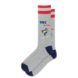 A pair of heather gray crew socks with red stripes at the top, navy blue heels and toes, and a colorful graphic of a skier with the text 'SKI you later' on the front sock, shown against a plain white background.