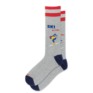 A pair of heather gray crew socks with red stripes at the top, navy blue heels and toes, and a colorful graphic of a skier with the text 'SKI you later' on the front sock, shown against a plain white background.