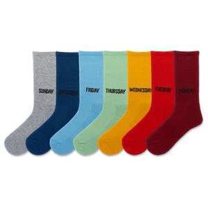 HOTSOX unisex seven pair crew sock pack with solid color socks in gray, navy, light blue, mint green, yellow, red-orange and red, featuring the day of the week knit into the cuff.
