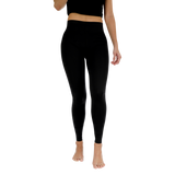 Person wearing black leggings on a white background