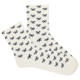 White women's socks with black bow pattern on a white background thumbnail