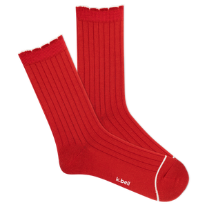 Red ribbed socks with white trim on a white background