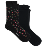 Two pairs of black crew socks with ruffled cuffs, one featuring a small pink and red floral pattern with green leaves, and the other solid black. The brand name 'it bell' is printed on the toe of the patterned sock.