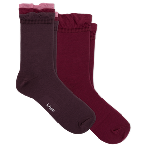 Three pairs of women's crew socks in dark plum, burgundy, and dusty rose, arranged overlapping on a plain white background. The brand name 'kbell' is printed in white on the toe of the front sock.