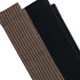 Two ribbed knit socks oshown diagonally on a white background, one in taupe-brown and one in black. thumbnail