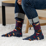 Person wearing blue socks with Thanksgiving-themed design on a white carpet