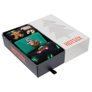 Three pairs of Christmas-themed socks in a 'HOTSOX' box on a white background