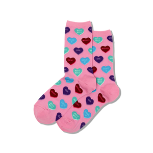 Pink socks with colorful heart candy patterns on a white background