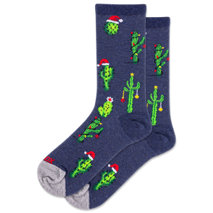 Navy blue socks with green cactus designs and red Santa hats on a white background
