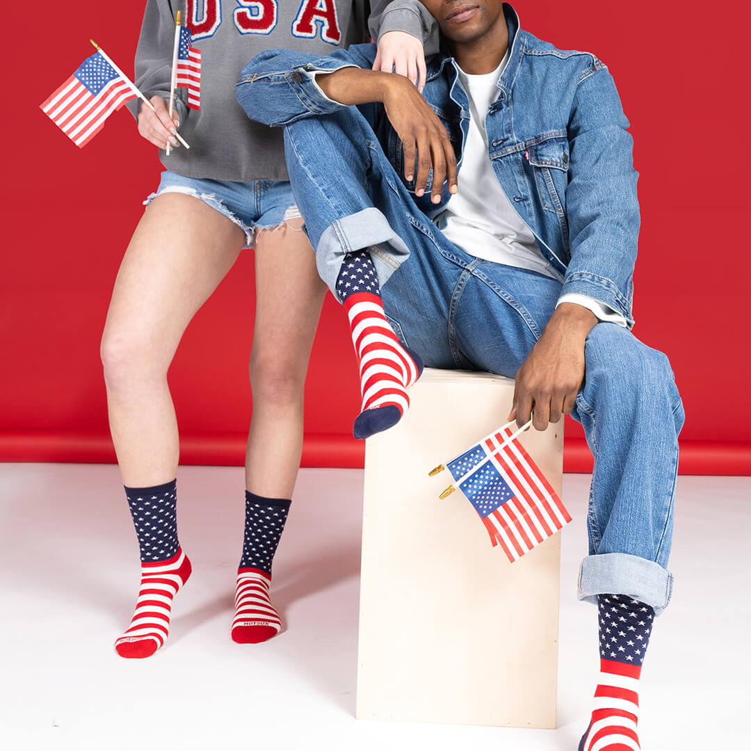 Two people wearing Americana-themed HOTSOX. 
