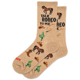 Beige socks with rodeo-themed designs and text on a white background