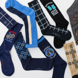 Collection of various socks with different designs and text on a white background thumbnail