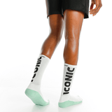 White socks with 'Iconic' branding worn by a person on a white background thumbnail