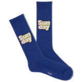 A pair of blue crew socks with the text 'SUNDAY' and a bell logo on the side.
