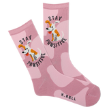 A pair of pink crew socks with a camouflage pattern and a cartoon depiction of a dog. The text 'stay pawsitive' is also featured on the socks.