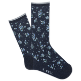 Navy socks with small floral pattern on a white background, featuring K. Bell branding. thumbnail