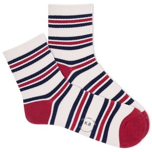 Beige K.Bell socks with navy and red stripes.