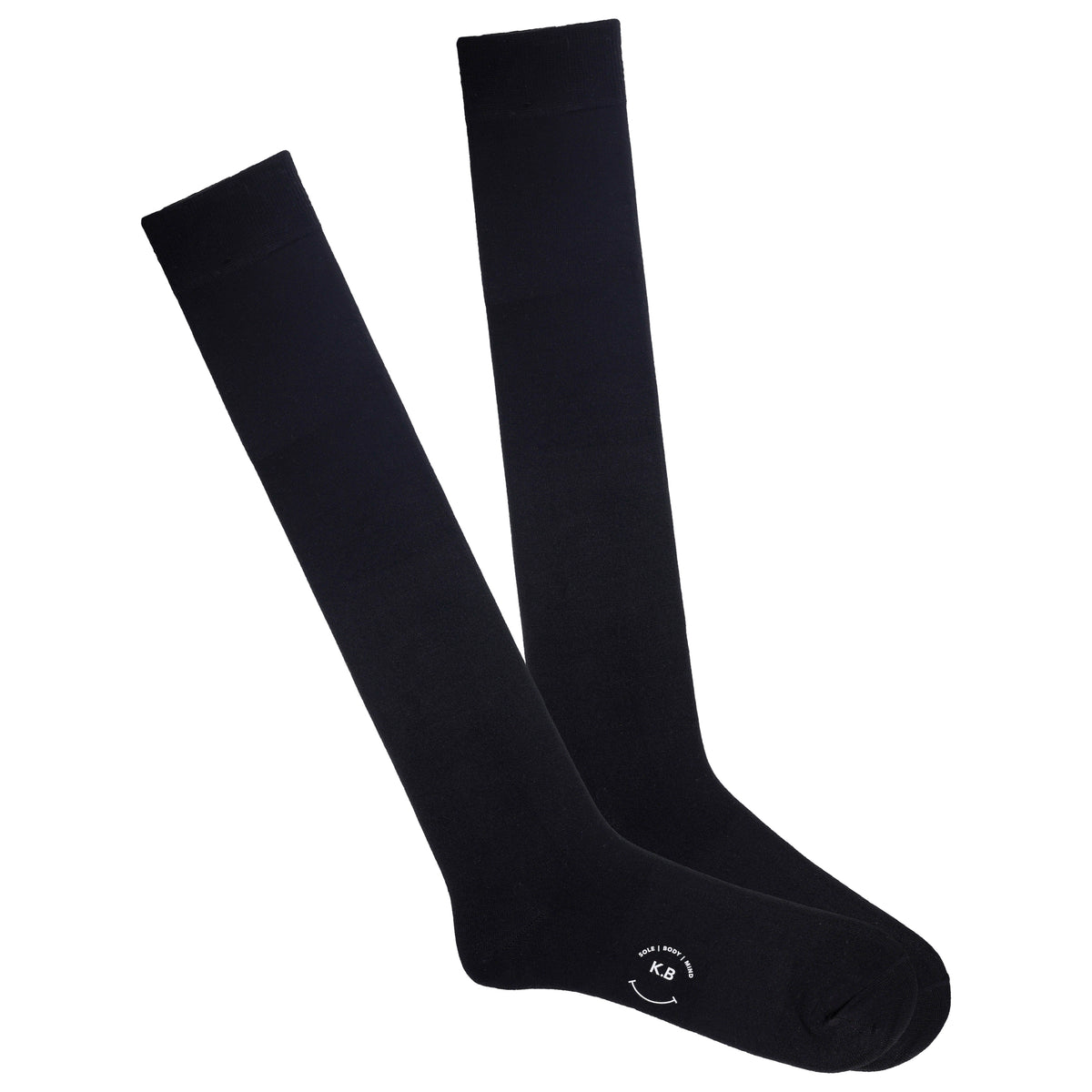 Pair of black knee-high socks on a white background