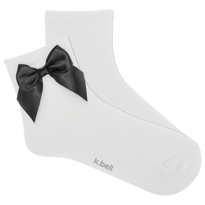 White sock with a black bow on a white background, featuring the brand 'k.bell'.