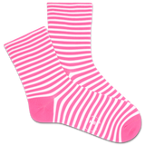 Pink and white striped socks being worn with a clear blue sky and palm trees in the background