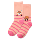 Person wearing pink and beige striped socks with fox designs on a gray floor.