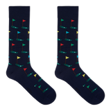 A pair of navy crew socks with a pattern of golf flags.